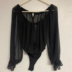 Black see-through bodysuit with opening in the front and in the sleeves